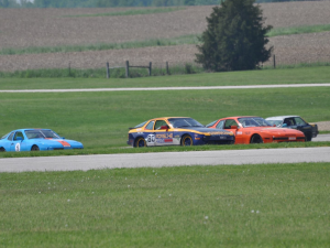 The husband (orange) and The Doctor (blue and yellow) are friends off the track and rivals on!